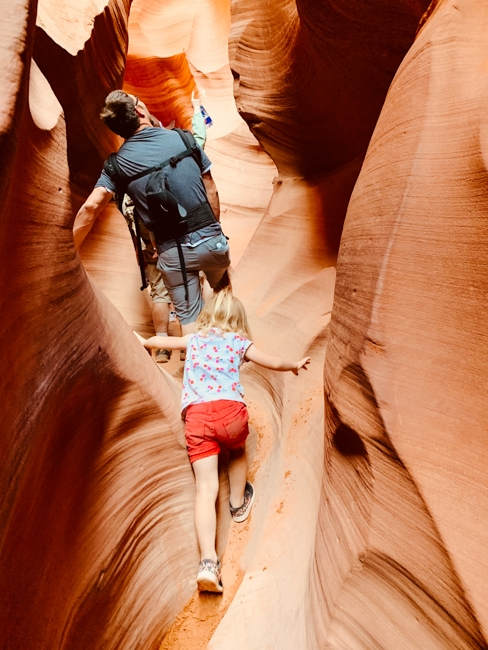 Family walking through Antelope Canyon