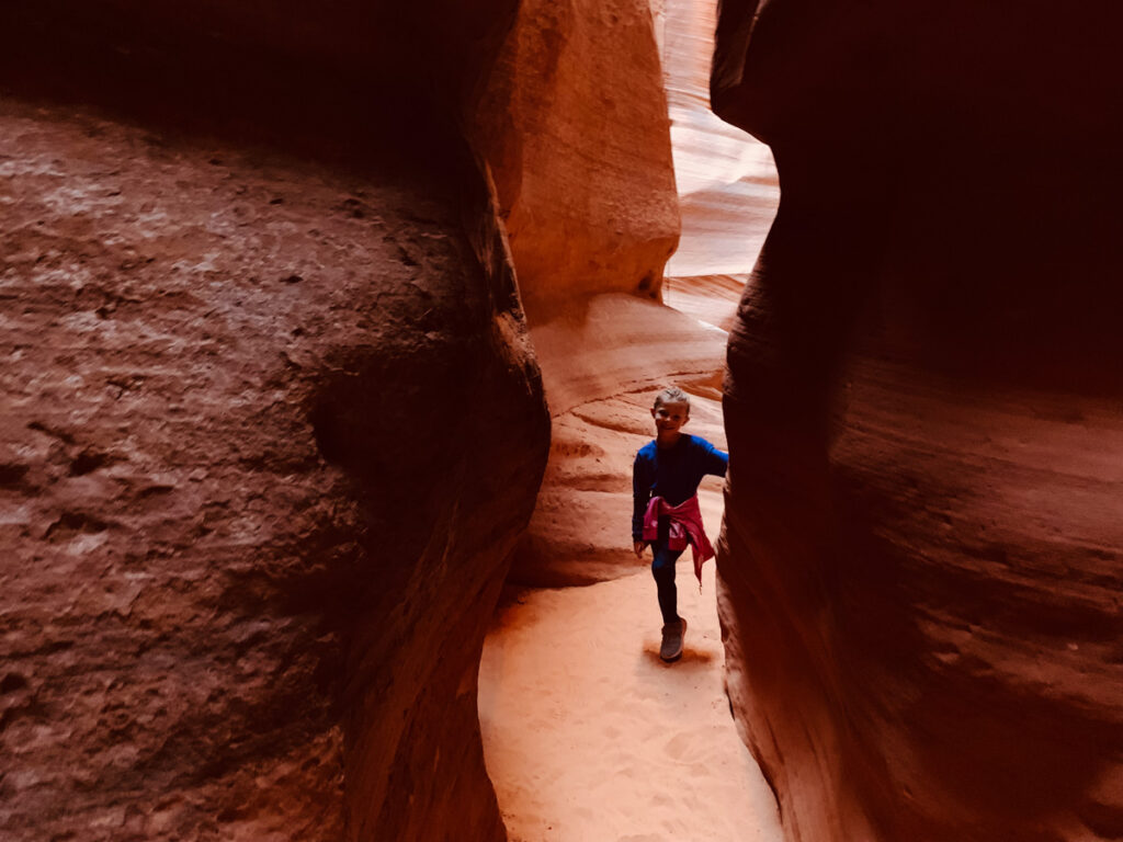 A girl standing in Antelope Canyon in Northern Arizona